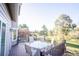 Relaxing outdoor deck with dining table, chairs, and beautiful views at 1431 Beacon Hill Dr, Highlands Ranch, CO 80126