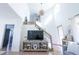 Bright entryway with hardwood floors, high ceilings, and a staircase with wood railing at 1431 Beacon Hill Dr, Highlands Ranch, CO 80126