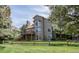 Two-story home with a well-maintained lawn, spacious deck, and a private, fenced yard at 1431 Beacon Hill Dr, Highlands Ranch, CO 80126