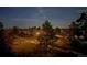 Beautiful night view with city lights and moonlit sky at 1431 Beacon Hill Dr, Highlands Ranch, CO 80126