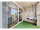 Balcony with swing and sliding glass doors entering into the home at 9944 E Carolina Cir # 201, Aurora, CO 80247
