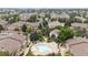 A serene community pool with surrounding lounge seating and a charming clubhouse in a well-maintained neighborhood at 9944 E Carolina Cir # 201, Aurora, CO 80247