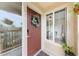 Inviting front door adorned with a wreath, natural light, and a glimpse of the interior at 9944 E Carolina Cir # 201, Aurora, CO 80247