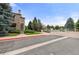Building entrance featuring stone accents and lush landscaping at 9944 E Carolina Cir # 201, Aurora, CO 80247
