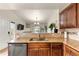 Kitchen features granite countertops and wooden cabinets at 9944 E Carolina Cir # 201, Aurora, CO 80247