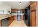 Kitchen features granite countertops and black appliances at 9944 E Carolina Cir # 201, Aurora, CO 80247