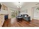 Comfortable living room with hardwood floors, fireplace, balcony access, and modern decor at 9944 E Carolina Cir # 201, Aurora, CO 80247