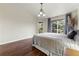 Cozy main bedroom features a large window with exterior views at 9944 E Carolina Cir # 201, Aurora, CO 80247
