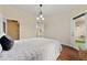 Spacious main bedroom features a stylish accent wall and private door to the outside at 9944 E Carolina Cir # 201, Aurora, CO 80247