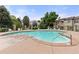 Community pool with ample seating and landscaping at 9944 E Carolina Cir # 201, Aurora, CO 80247