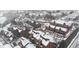 Aerial view of condo community covered in snow with various building elevations and mature trees at 343 W Lehow Ave # 14A, Englewood, CO 80110