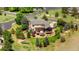 Aerial view of a home with a beautiful outdoor space with a hot tub and green trees at 12665 S Robinson Ranch Ct, Parker, CO 80134