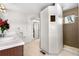 This bathroom boasts a glass enclosed shower, private toilet, walk-in closet and access to the bedroom at 12665 S Robinson Ranch Ct, Parker, CO 80134