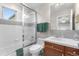 This bathroom features a tub and shower combination and a white sink at 12665 S Robinson Ranch Ct, Parker, CO 80134
