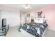 This bedroom features a large closet, ensuite bath and a fun bedspread at 12665 S Robinson Ranch Ct, Parker, CO 80134
