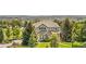 Charming two-story home boasts stone accents, lush landscaping and beautiful curb appeal at 12665 S Robinson Ranch Ct, Parker, CO 80134