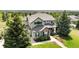 Charming two-story home boasting stone accents, lush landscaping and beautiful curb appeal at 12665 S Robinson Ranch Ct, Parker, CO 80134