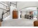 Entry foyer with staircase leading to the second floor and view of the dining room at 12665 S Robinson Ranch Ct, Parker, CO 80134