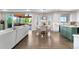 Open floor plan features kitchen, dining and living areas and opens to a covered outdoor living space at 12665 S Robinson Ranch Ct, Parker, CO 80134
