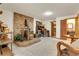 Basement with wood-burning stove and access to a bathroom with a wood door at 30122 Nancys Ln, Conifer, CO 80433