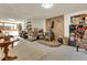 Cozy basement living area features a wood-burning stove and brick surround at 30122 Nancys Ln, Conifer, CO 80433