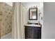 Traditional bathroom with a shower-tub combo and vanity with storage at 30122 Nancys Ln, Conifer, CO 80433