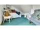 Cozy bedroom with blue carpet, daybed, and charming decor, perfect for a room or guest retreat at 30122 Nancys Ln, Conifer, CO 80433
