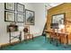 Home office featuring unique decor, wood accents, bright lighting, and cozy carpeting at 30122 Nancys Ln, Conifer, CO 80433