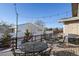 Outdoor deck features a dining set, grill, and string lights, perfect for entertaining at 5271 Routt Ct, Arvada, CO 80002