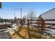 View of backyard with wood fence and string lights, offering privacy and ambiance at 5271 Routt Ct, Arvada, CO 80002