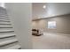 Open basement area with cozy seating and natural light, ideal for entertaining at 5271 Routt Ct, Arvada, CO 80002