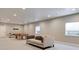 Spacious basement with a couch and a pool table, perfect for entertaining and relaxation at 5271 Routt Ct, Arvada, CO 80002