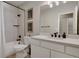 Stylish bathroom features a shower-tub combo, modern vanity, and updated fixtures at 5271 Routt Ct, Arvada, CO 80002