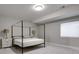 Bedroom boasts natural light, plush carpeting, and minimalist design at 5271 Routt Ct, Arvada, CO 80002