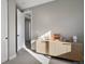 Bright bedroom with a built in cabinet and an open doorway to the rest of the home at 5271 Routt Ct, Arvada, CO 80002