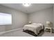 Bright bedroom with natural light, modern accents, and plush carpeting at 5271 Routt Ct, Arvada, CO 80002