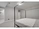 Modern bedroom offers a minimalist bed frame and adjacent walk-in closet at 5271 Routt Ct, Arvada, CO 80002