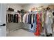 Walk-in closet with ample storage space, organized shelving, and plenty of hanging rods at 5271 Routt Ct, Arvada, CO 80002
