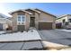 Modern two-story home with brick and siding, attached garage, and snow-covered landscaping at 5271 Routt Ct, Arvada, CO 80002