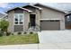Charming single-Gathering home with brick accents, well-manicured lawn, and a two-car garage, creating excellent curb appeal at 5271 Routt Ct, Arvada, CO 80002