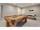 Spacious game room features a billiard table, foosball table, and modern decor at 5271 Routt Ct, Arvada, CO 80002