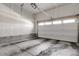 Spacious garage with ample storage space and a functional garage door at 5271 Routt Ct, Arvada, CO 80002