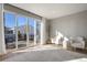 Sun-drenched living room with access to the outdoor patio, modern furniture, and lots of space at 5271 Routt Ct, Arvada, CO 80002