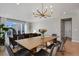 Open concept living room with direct view to sliding glass doors, dining area, and living area at 5271 Routt Ct, Arvada, CO 80002