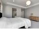 Well-lit main bedroom with a comfortable bed, modern furnishings, and ensuite bathroom at 5271 Routt Ct, Arvada, CO 80002