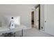 Bright home office with modern desk and view into the adjacent room with sleek door at 5271 Routt Ct, Arvada, CO 80002