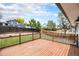 Large, well-maintained back deck with lawn and landscaping at 6775 Newland St, Arvada, CO 80003