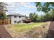 This home features a spacious backyard and a wooden deck, perfect for outdoor entertaining and relaxation at 6775 Newland St, Arvada, CO 80003
