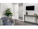 Basement featuring a stylish chair, modern console, and a sliding closet door at 6775 Newland St, Arvada, CO 80003