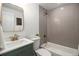 Modern bathroom with a soaking tub, tiled shower, and stylish vanity at 6775 Newland St, Arvada, CO 80003